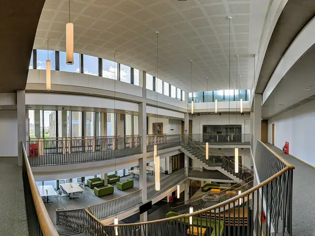 A bright, modern school atrium with a learning commons on three floors